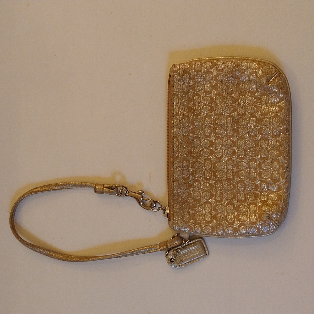 VGUC. Coach silver and tan wristlet.